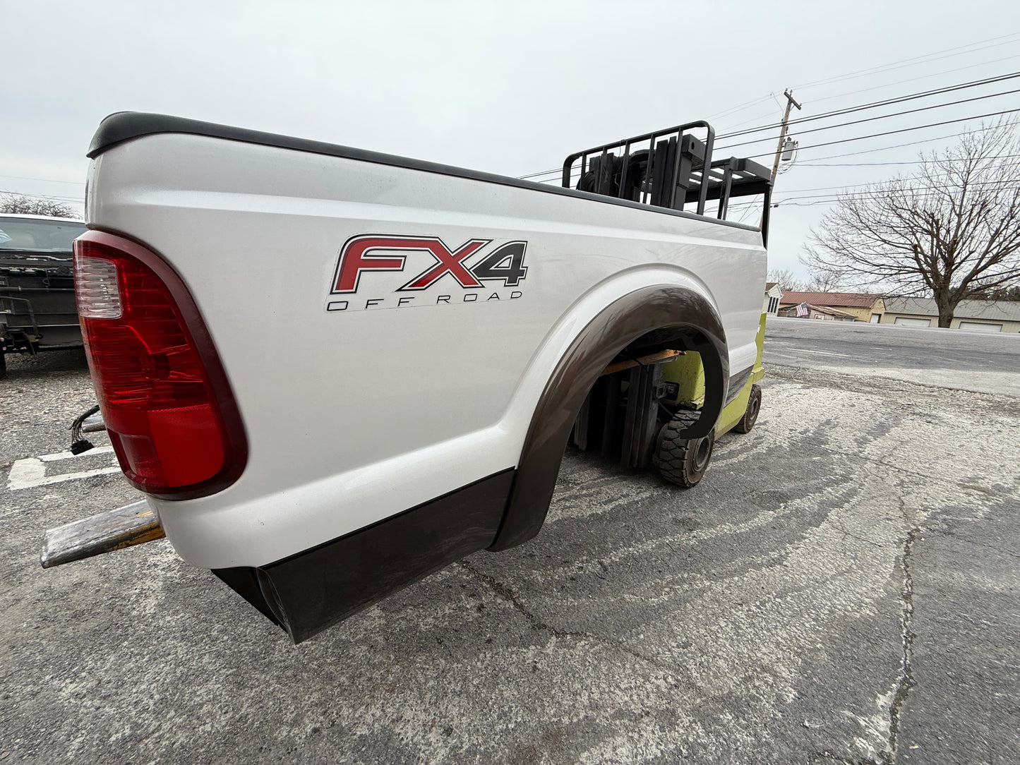 11-16 Superduty 6’9” short bed Pearl White/ Caribou #12706